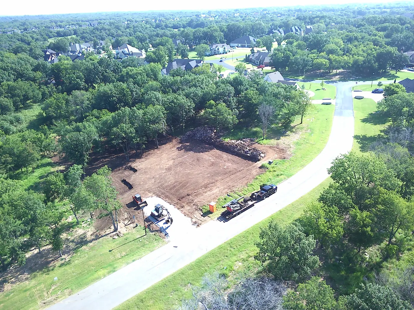 J&S Contracting grading equipment at a residential jobsite
